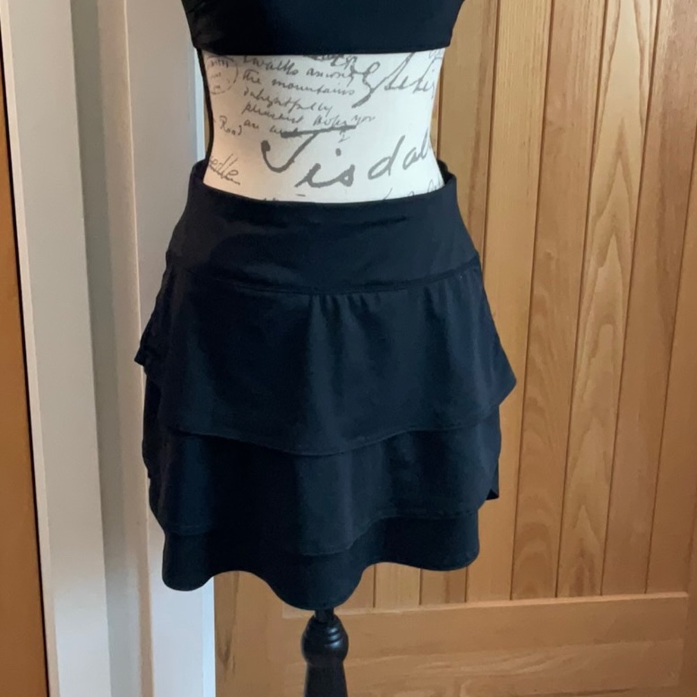 Women’s black Athleta skirt with short insert. New condition. Small